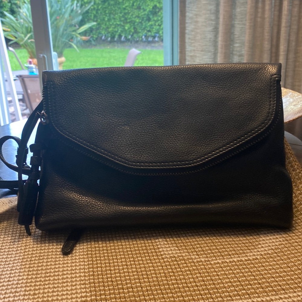 Tumi leather clutch/ crossbody bag